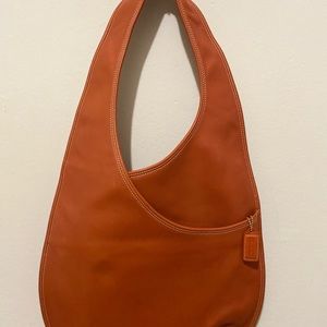 Leather tote with cosmetics blemishes on inside